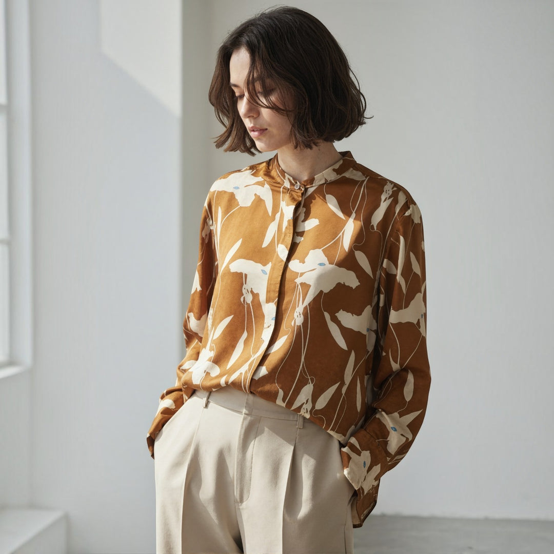 NANOKA LIVING ｜和洋選品 Ballsey light brown boxy shirt with floral print and piping detail worn by a woman