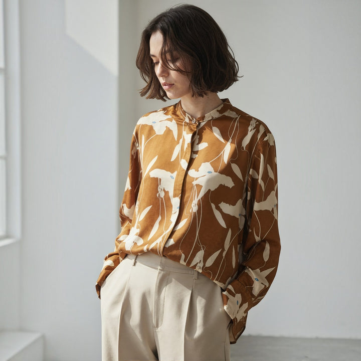 NANOKA LIVING ｜和洋選品 Ballsey light brown boxy shirt with floral print and piping detail worn by a woman